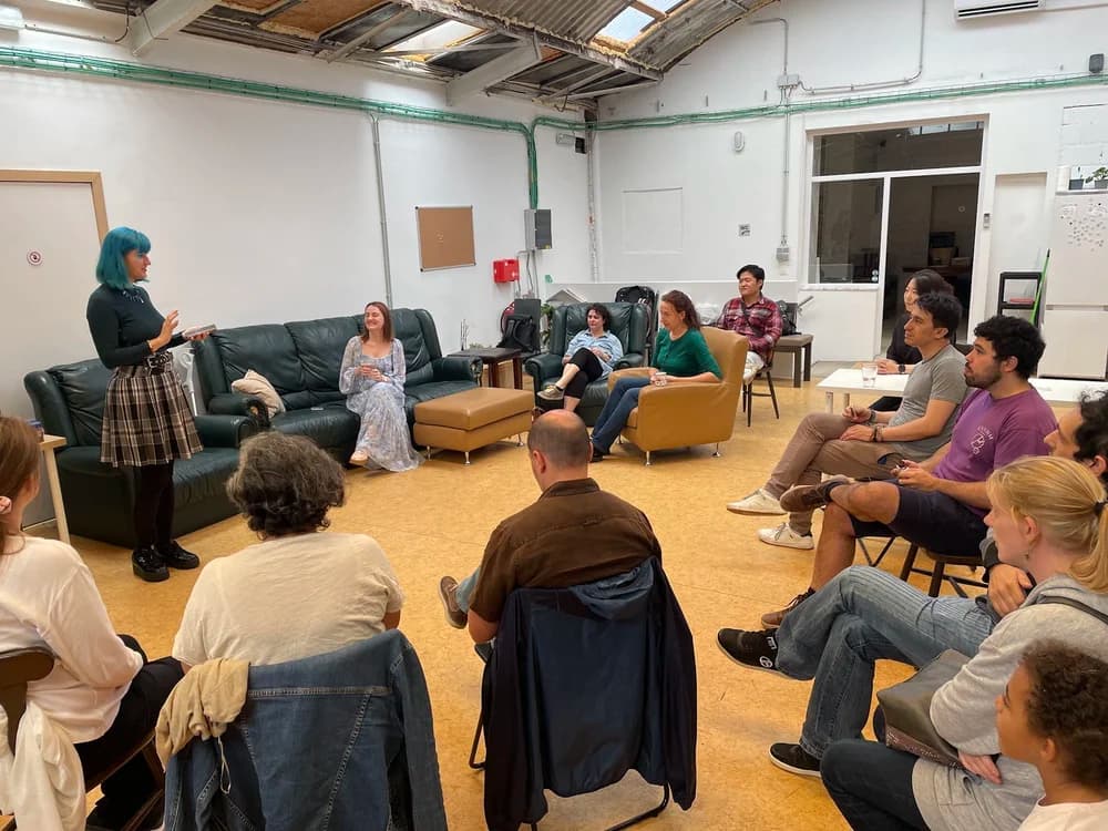 Members in a circle in the studio