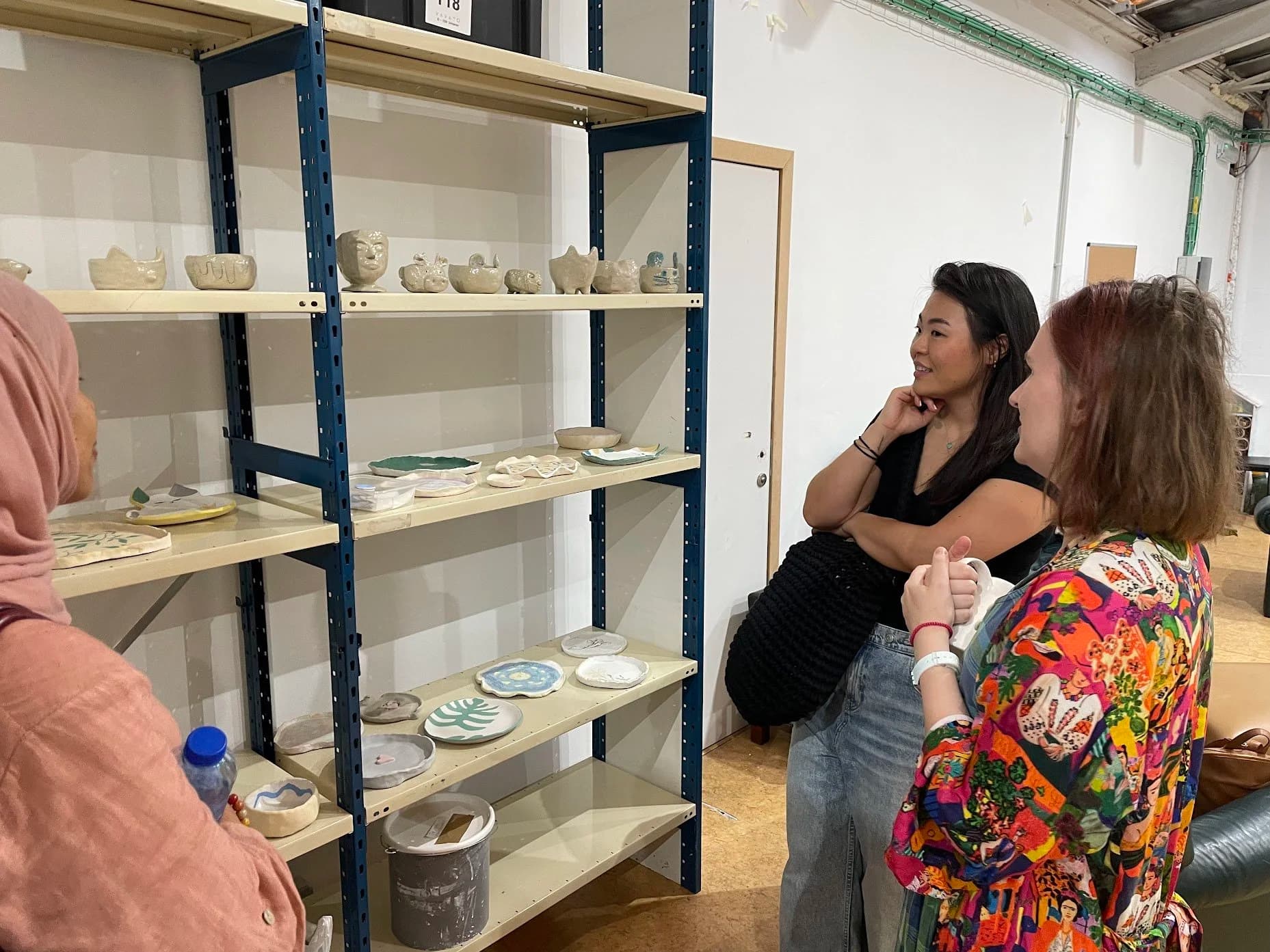 Visitors looking at pieces made in the studio